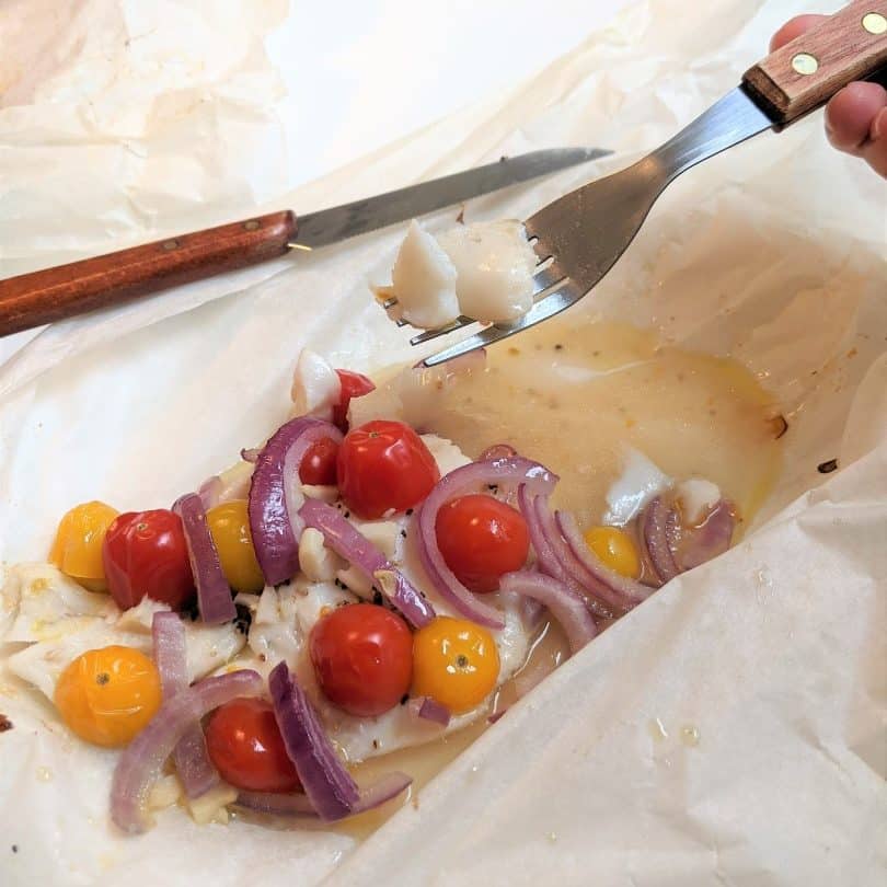Forkful of Alaskan Rockfish with tomatoes