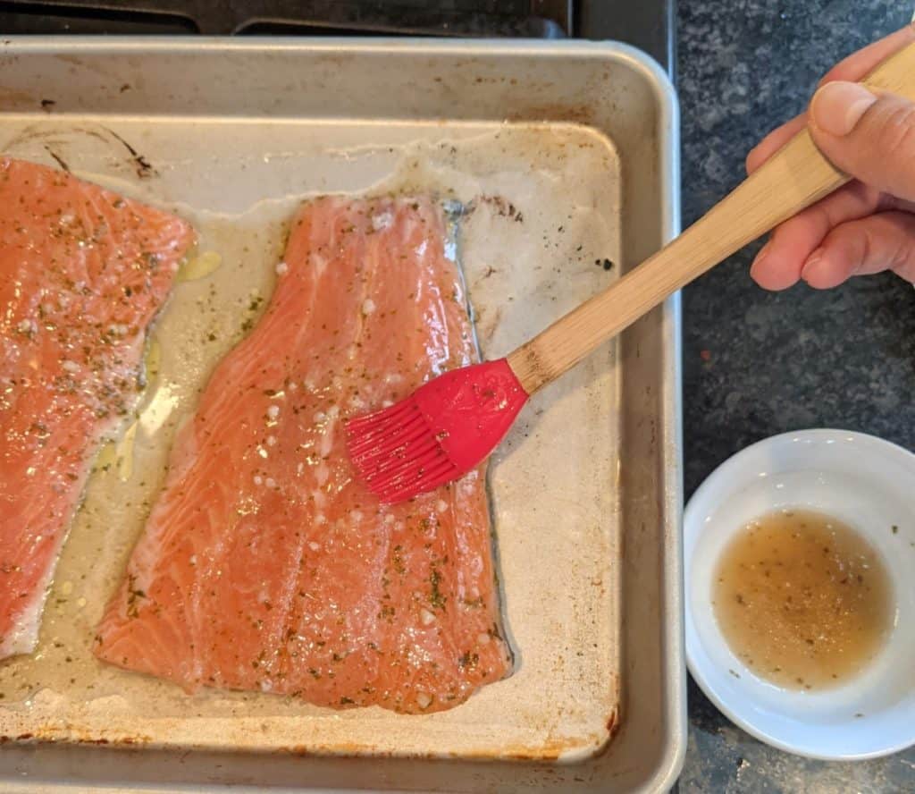applying the glaze to the wild alaskan salmon