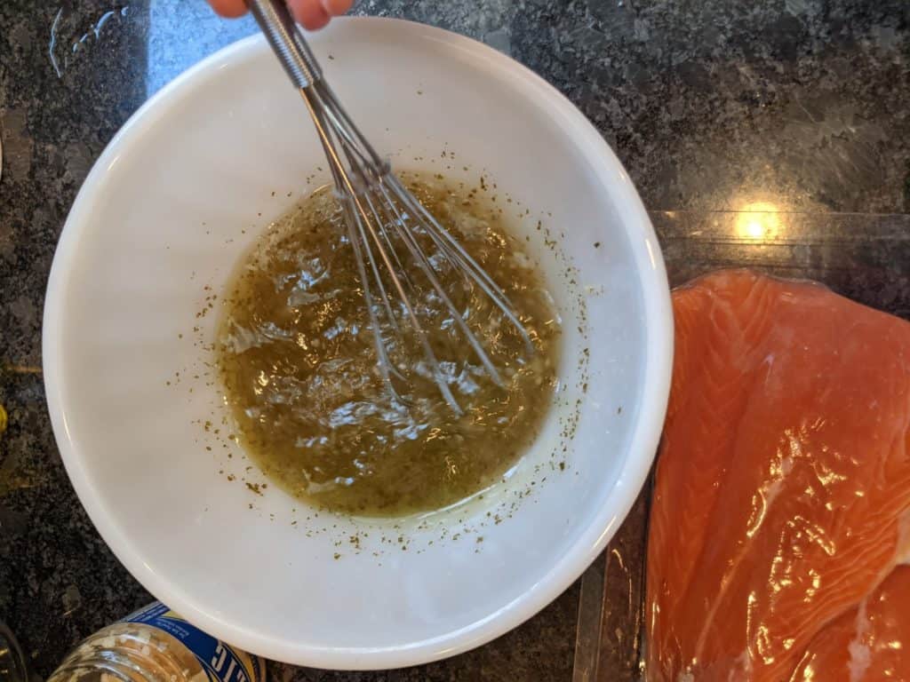 Whisking marinade for the Wild Alaskan Apple Maple Salmon