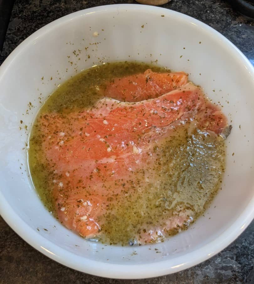 Wild Alaskan salmon marinating in bowl.