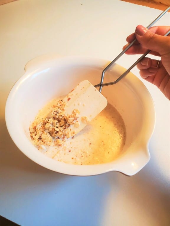 mixing all ingredients to make protein overnight oats