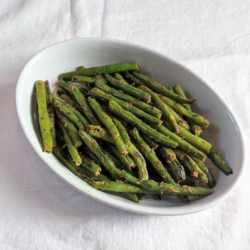 Final dish full of mustard green beans.