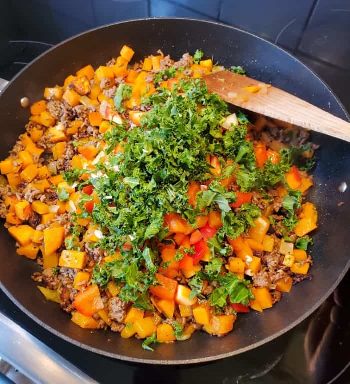 Adding Kale and Red Pepper to the Sauteed Sweet Potato