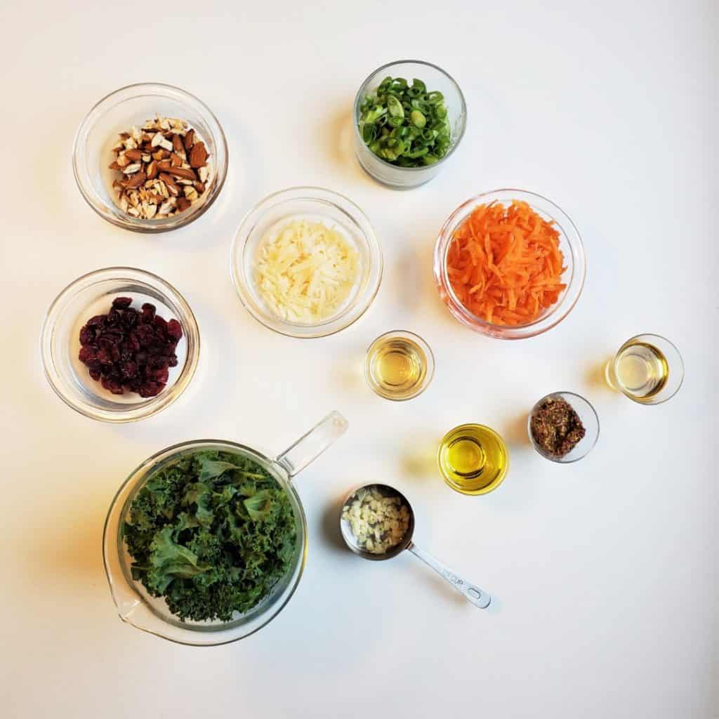Ingredients in bowls for winter kale crunch salad