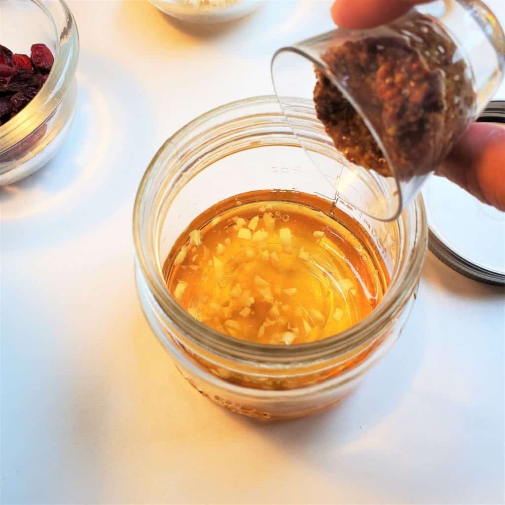 Apple cider vinaigrette dressing in a mason jar