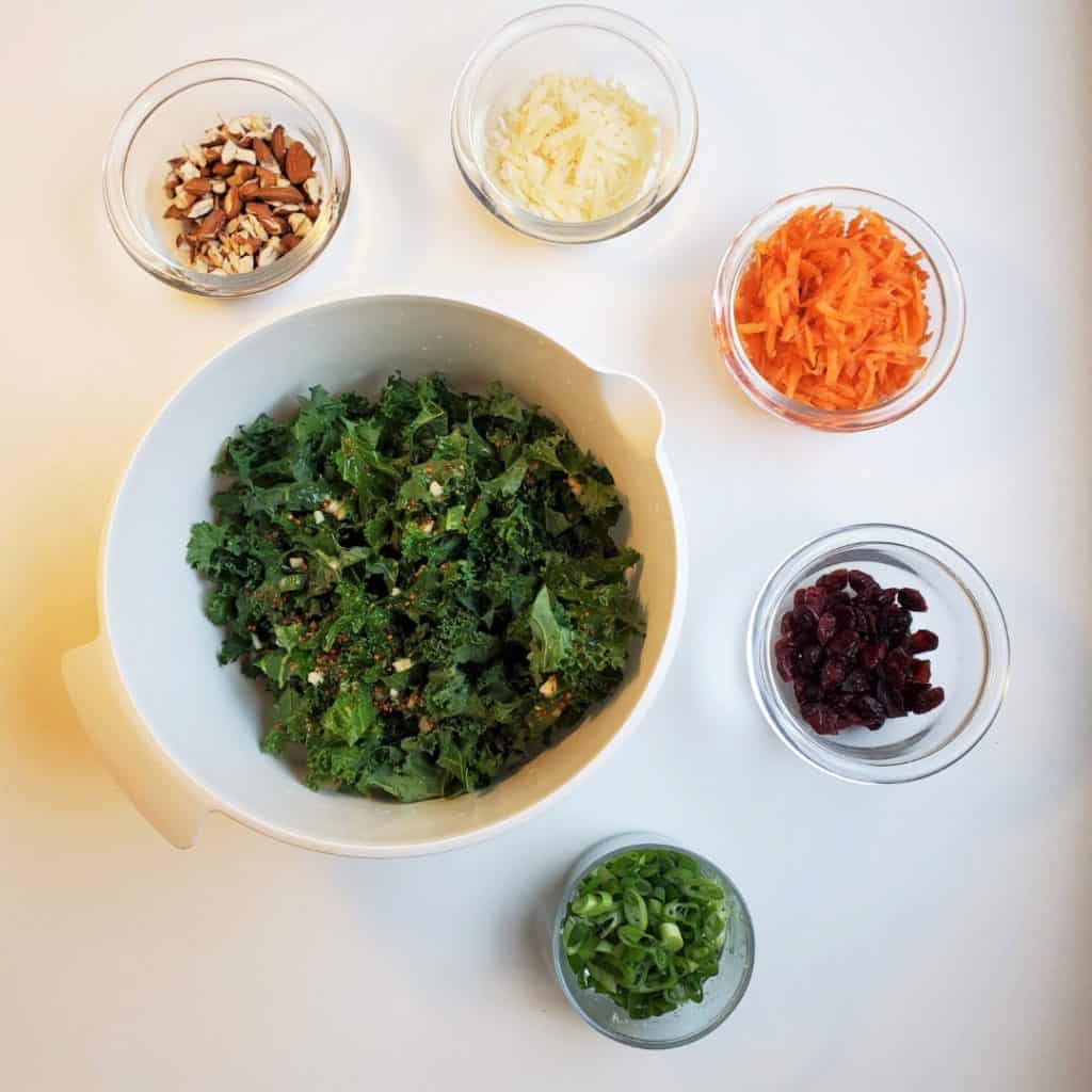 Ingredients in bowls for kale crunch salad recipe.