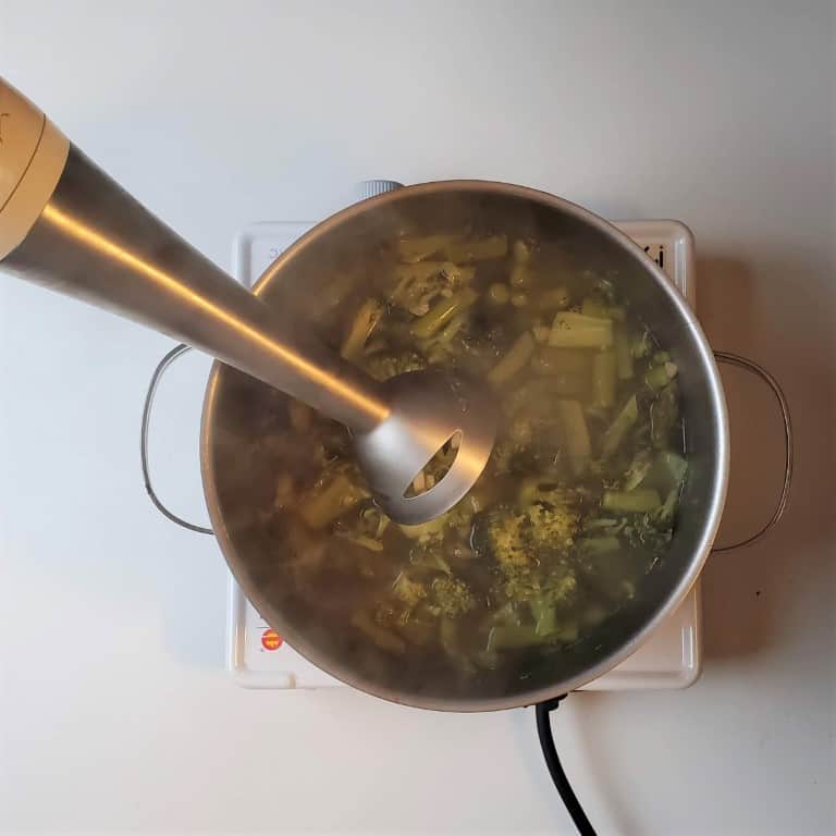 immersion blender on broccoli and asparagus soup