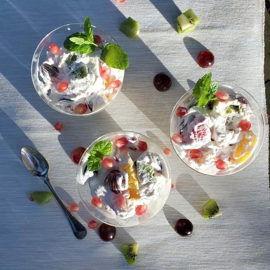 fruit cream dessert in clear glasses