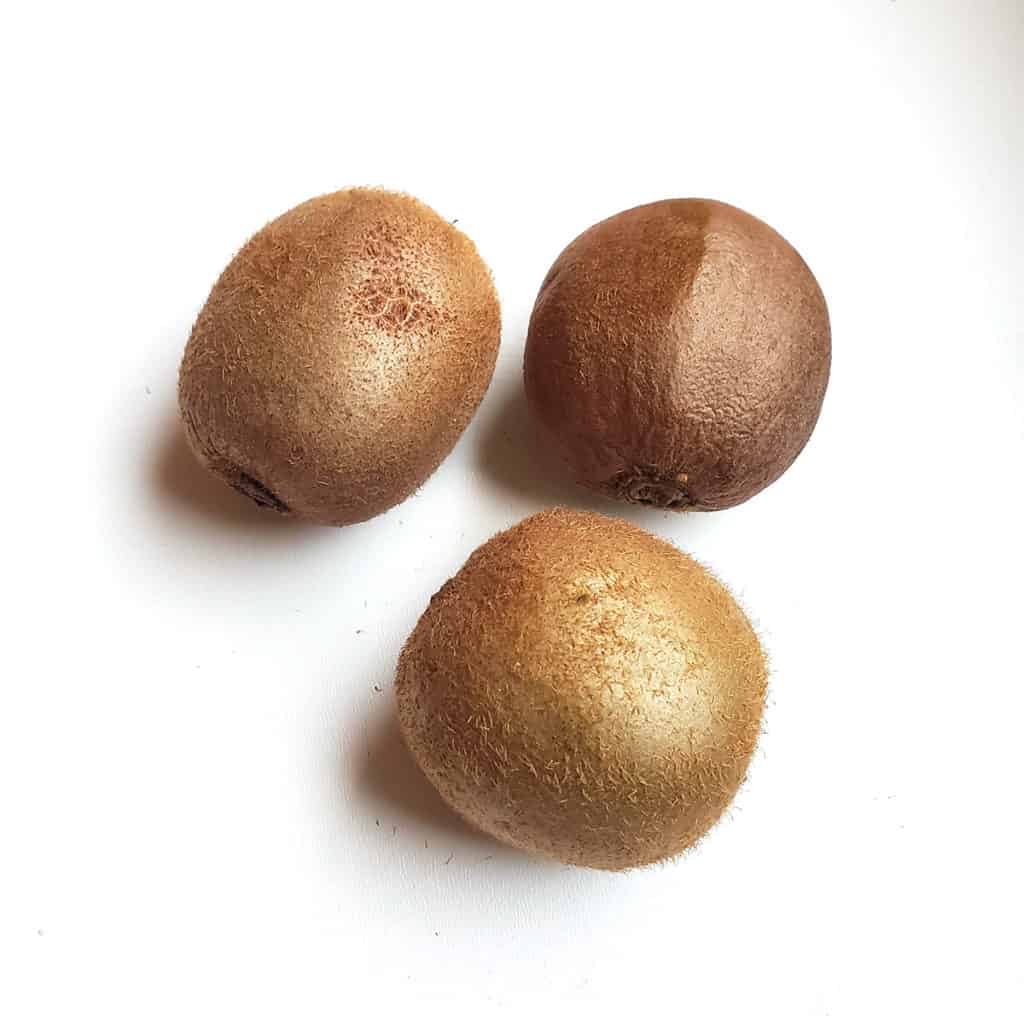 three kiwi fruits