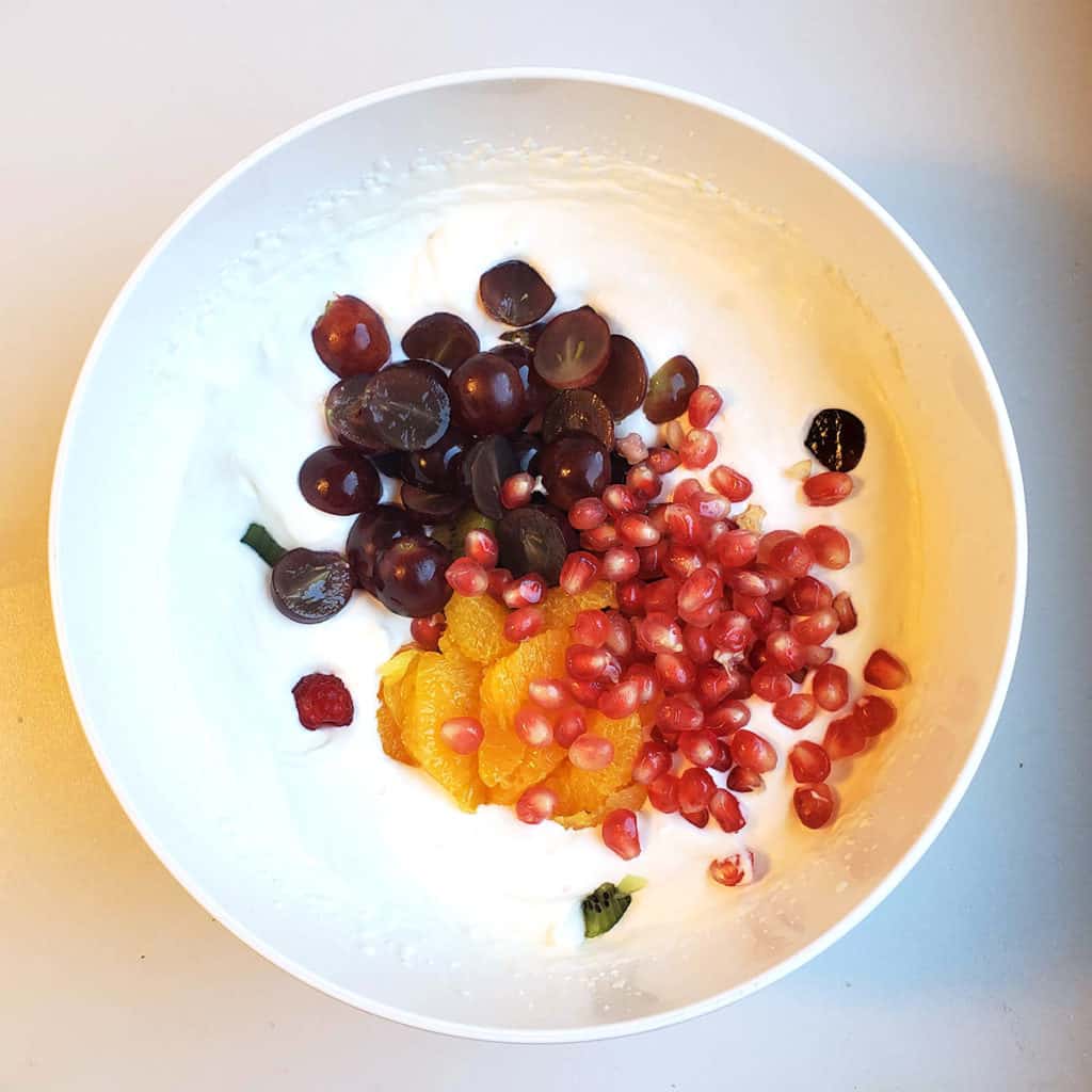 Fruits in large bowl of cream