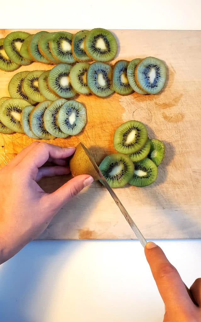 Slicing Kiwis on Cutting Board