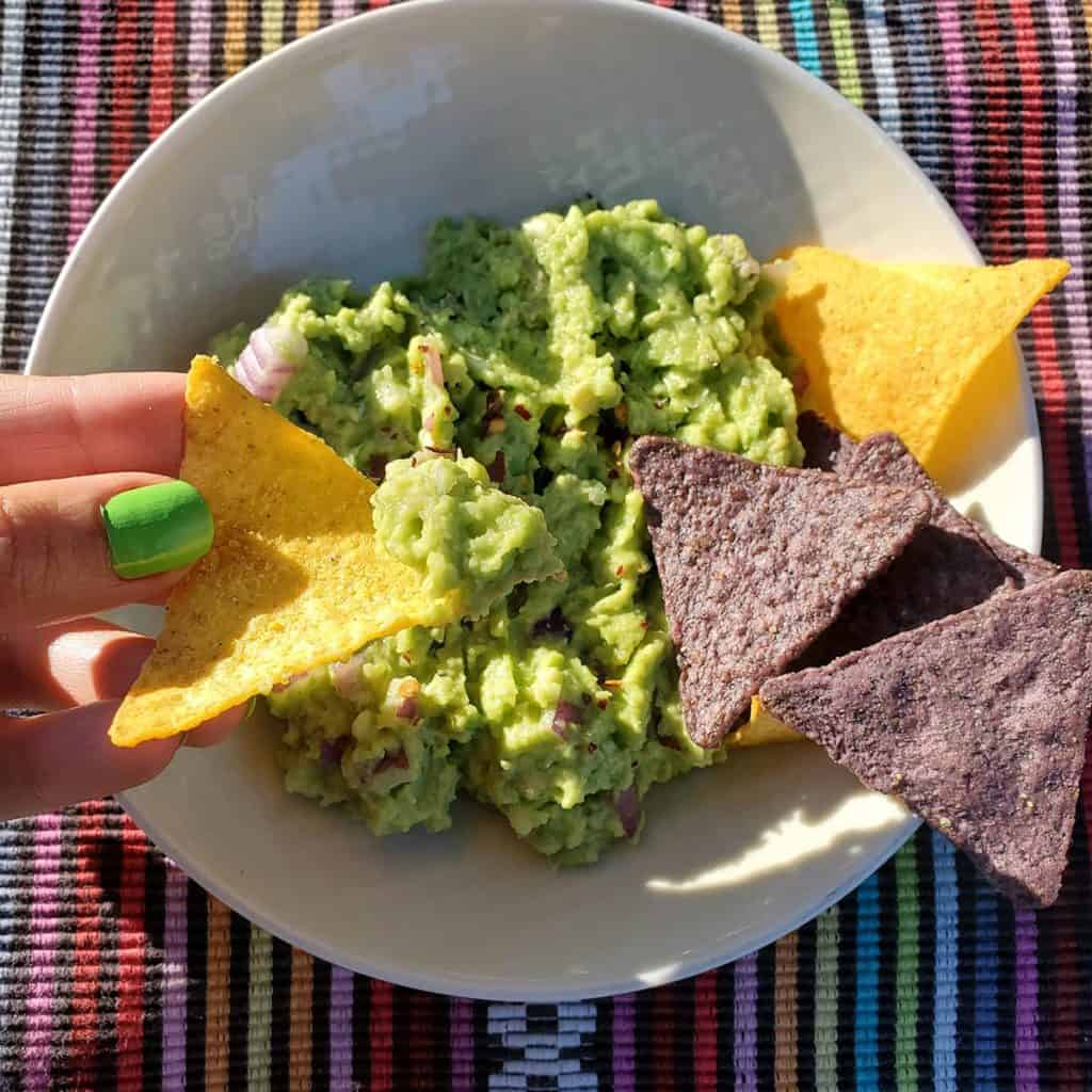 4-Ingredient Guacamole in Bowl with Colorful Corn Chips